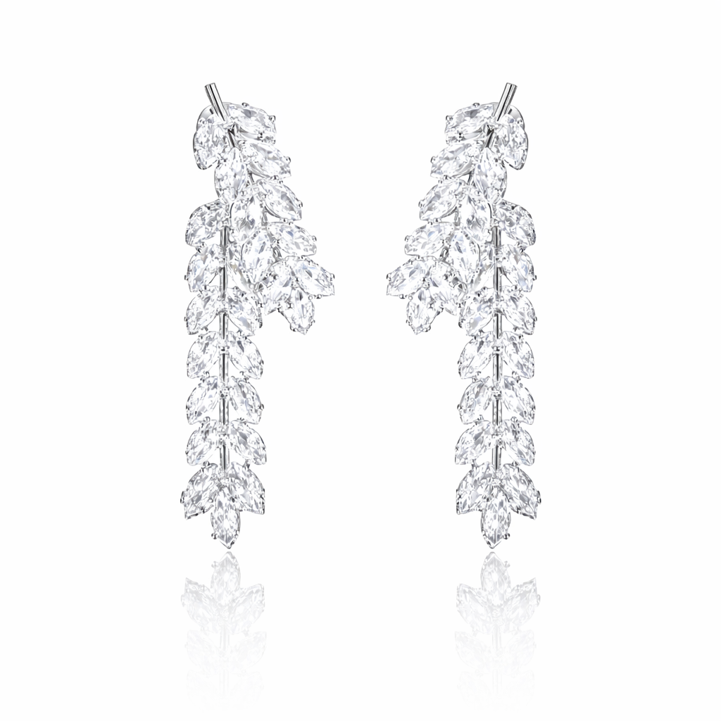 Pair of diamond leaf earrings on a white background