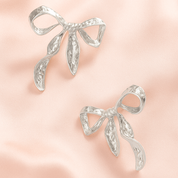 Ribbon Twist Hammered Bow Earrings | Silver