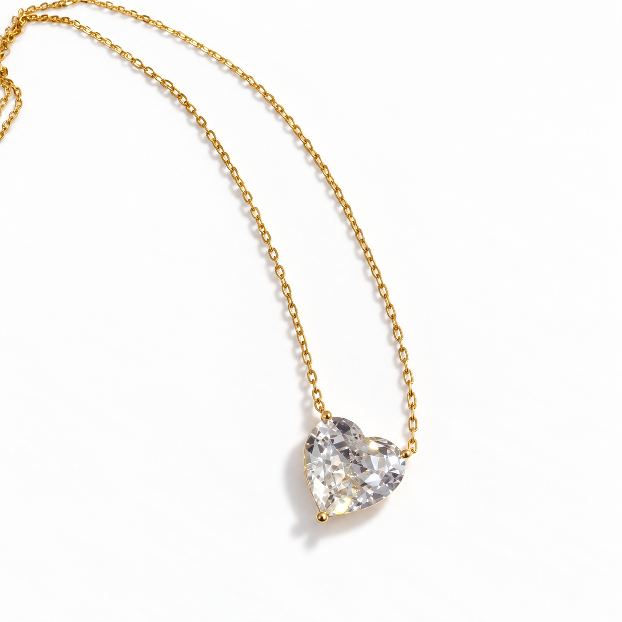 Close-up of gold heart necklace featuring a brilliant clear heart-cut cubic zirconia stone in a delicate gold setting – Valentina-Rose