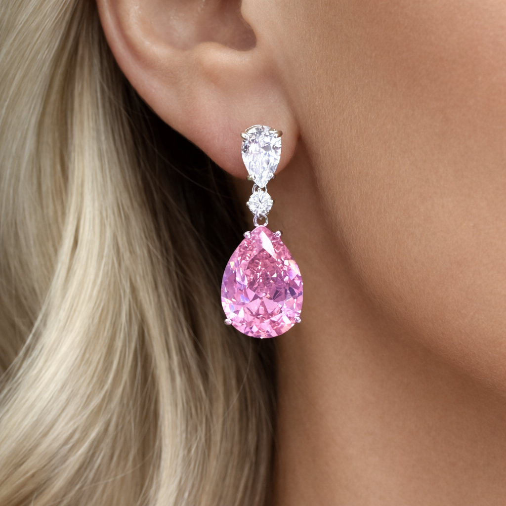Rose pink teardrop drop earrings in 925 sterling silver with pear cut crystal, luxury statement earrings on model
