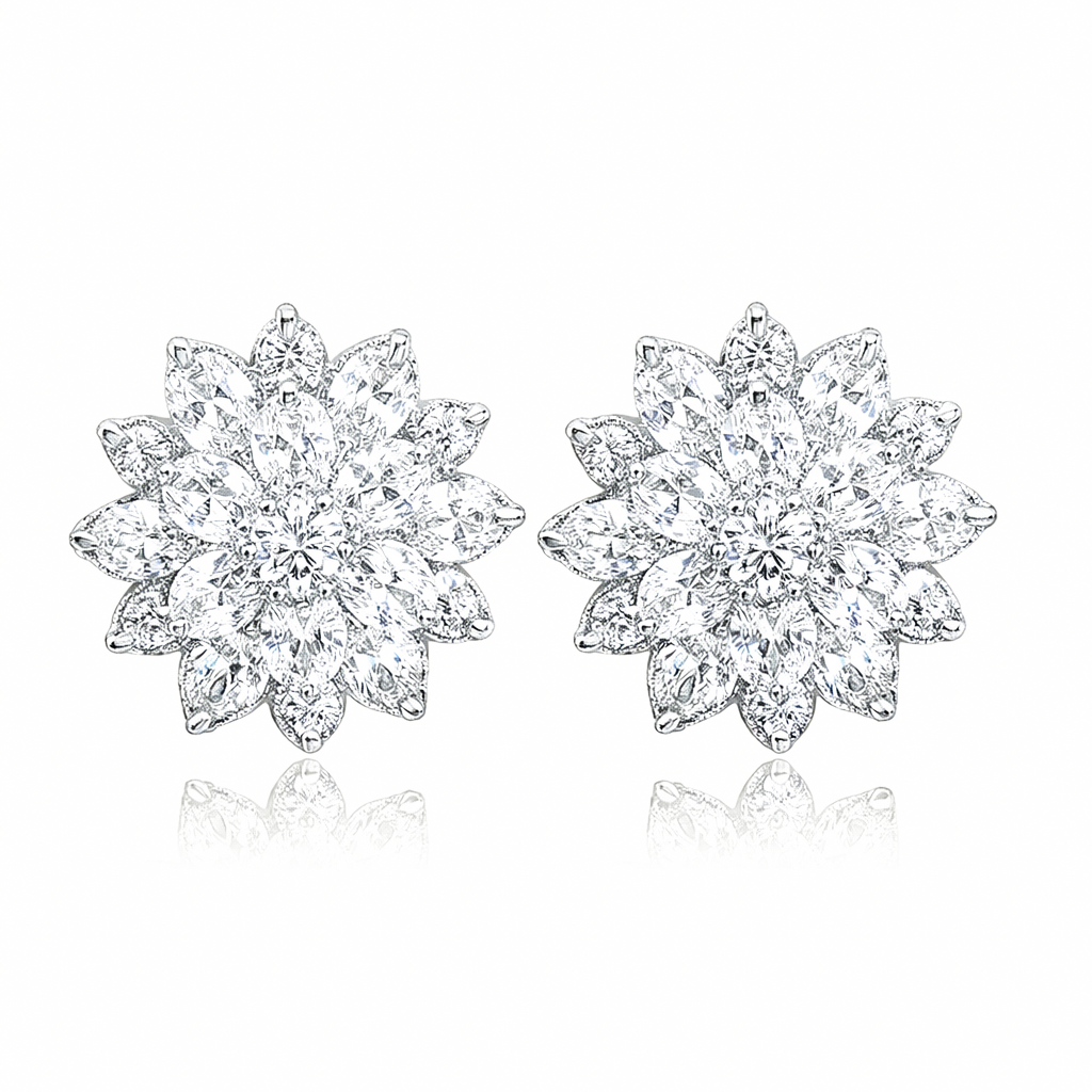 Pair of floral cluster silver earrings on a white background